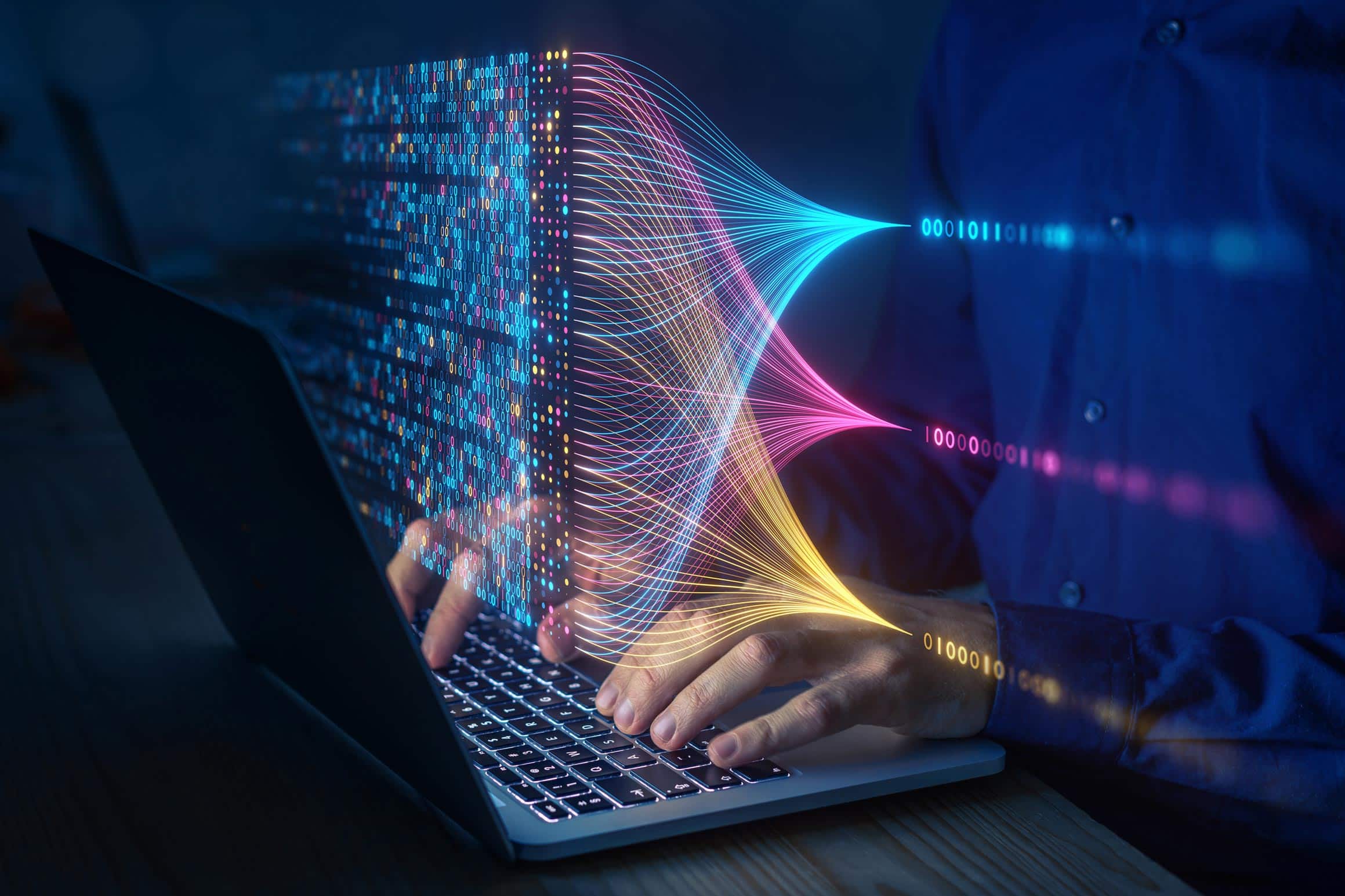 Person typing on laptop as colorful data streams illustrate eDiscovery Consulting Services.