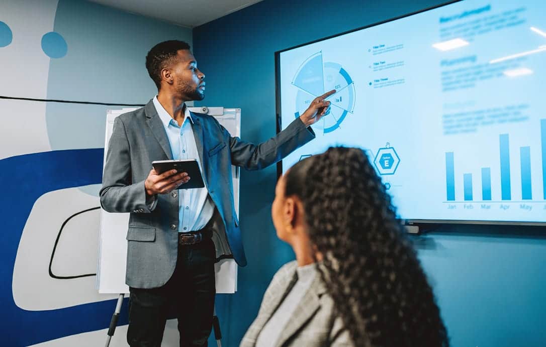 Businessman presenting results on TV
