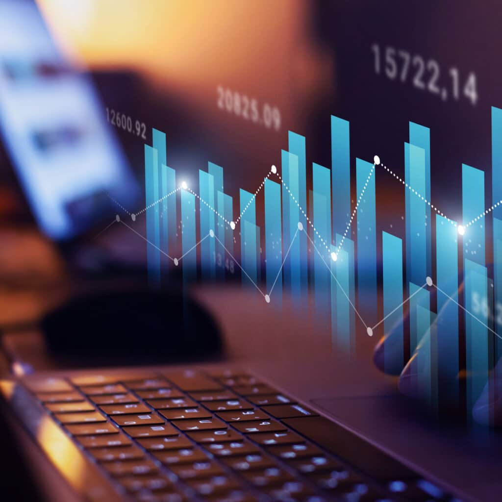 Laptop keyboard with graphs, symbolizing law firm financial consulting and data analysis.