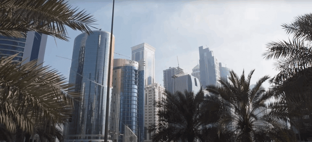Panoramic skyline of Doha Qatar during sunset.