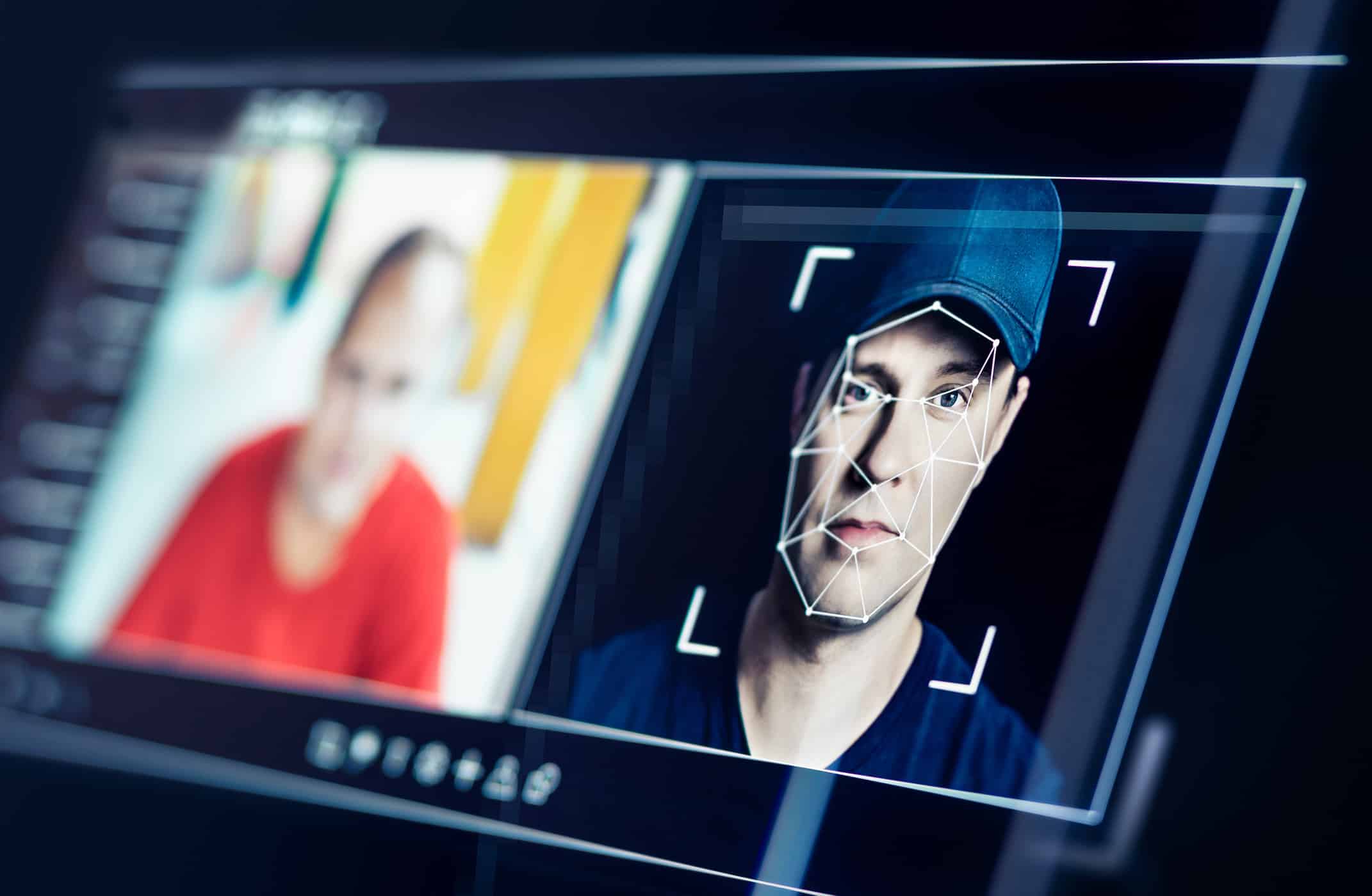 A screen displays AI-driven fraud prevention with facial recognition beside a blurred person.