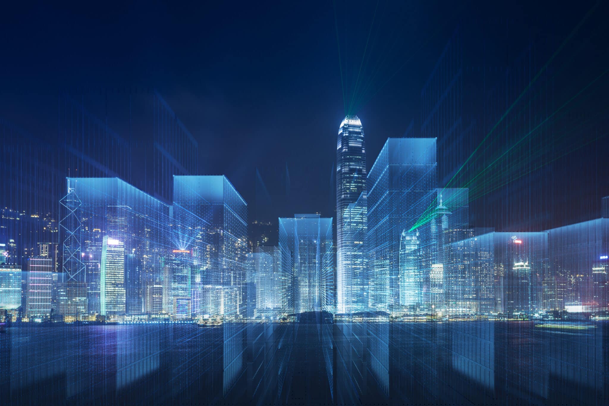 Futuristic city skyline with digital blue hologram buildings at night.