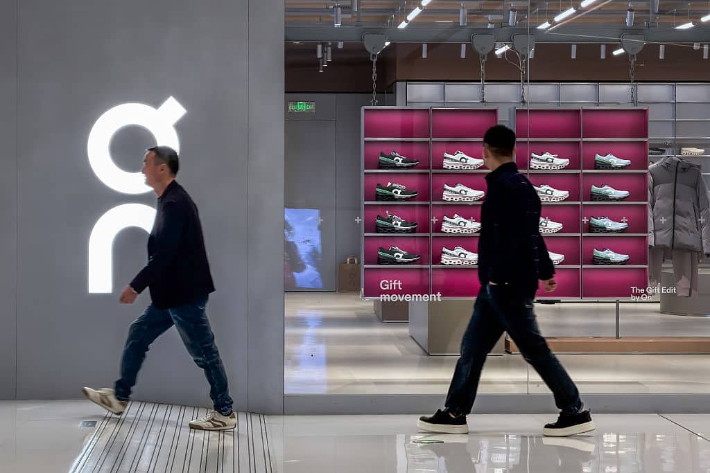Shoppers Walk Past Luxury Store in Chongqing Mall