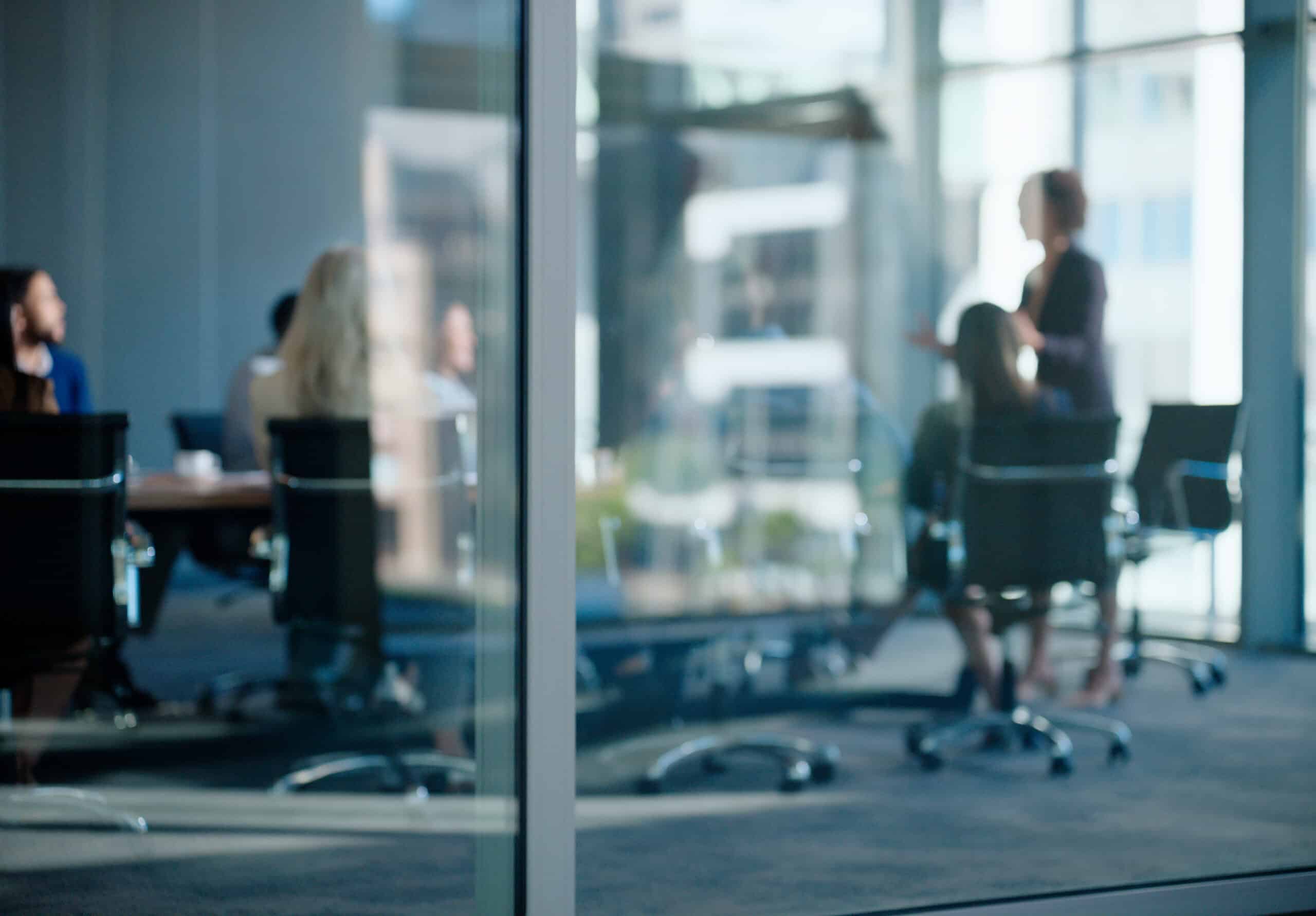 A group of enterprise application integration consultants in a meeting room.