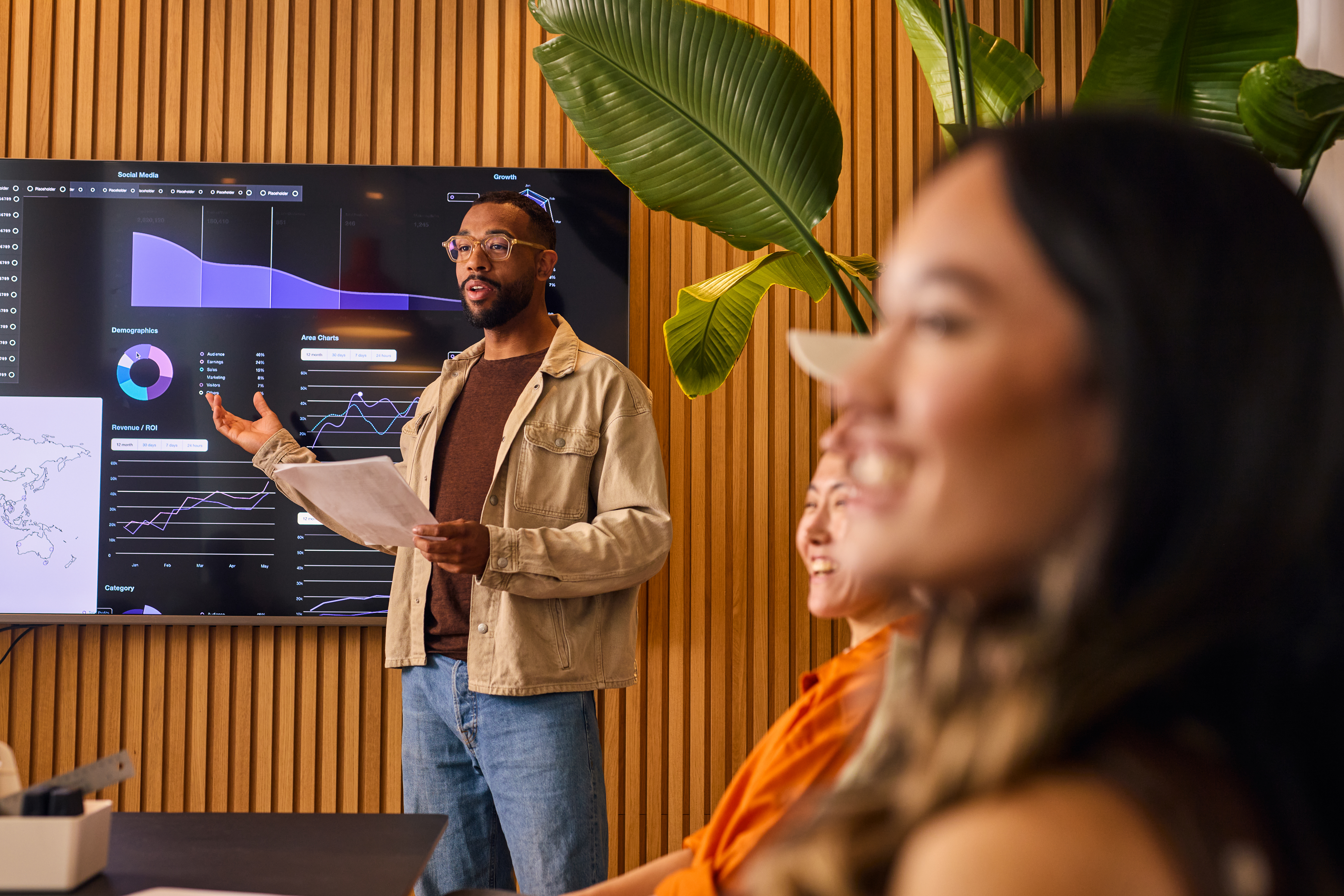 A man standing in front of a screen at a Smart Building Consulting session.