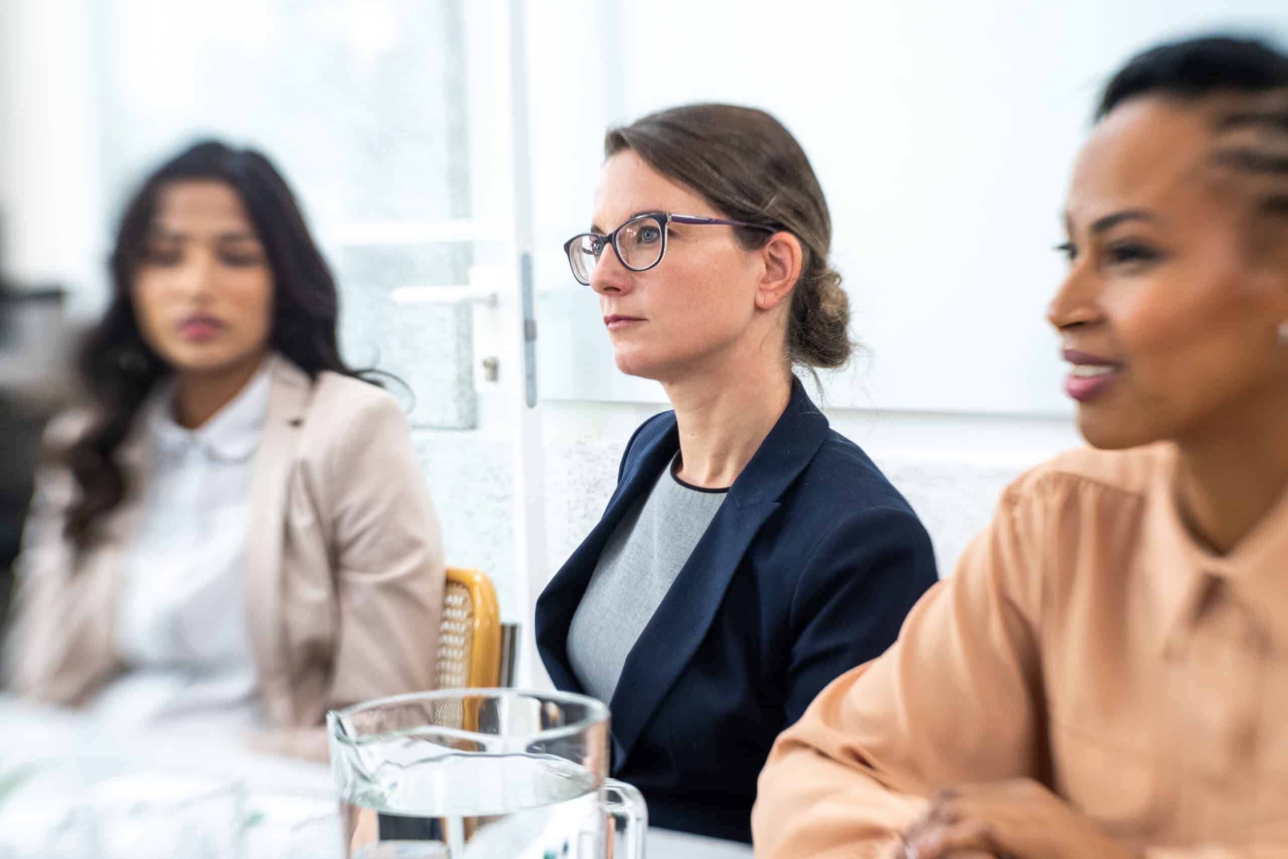 Businesswomen sitting in boardroom