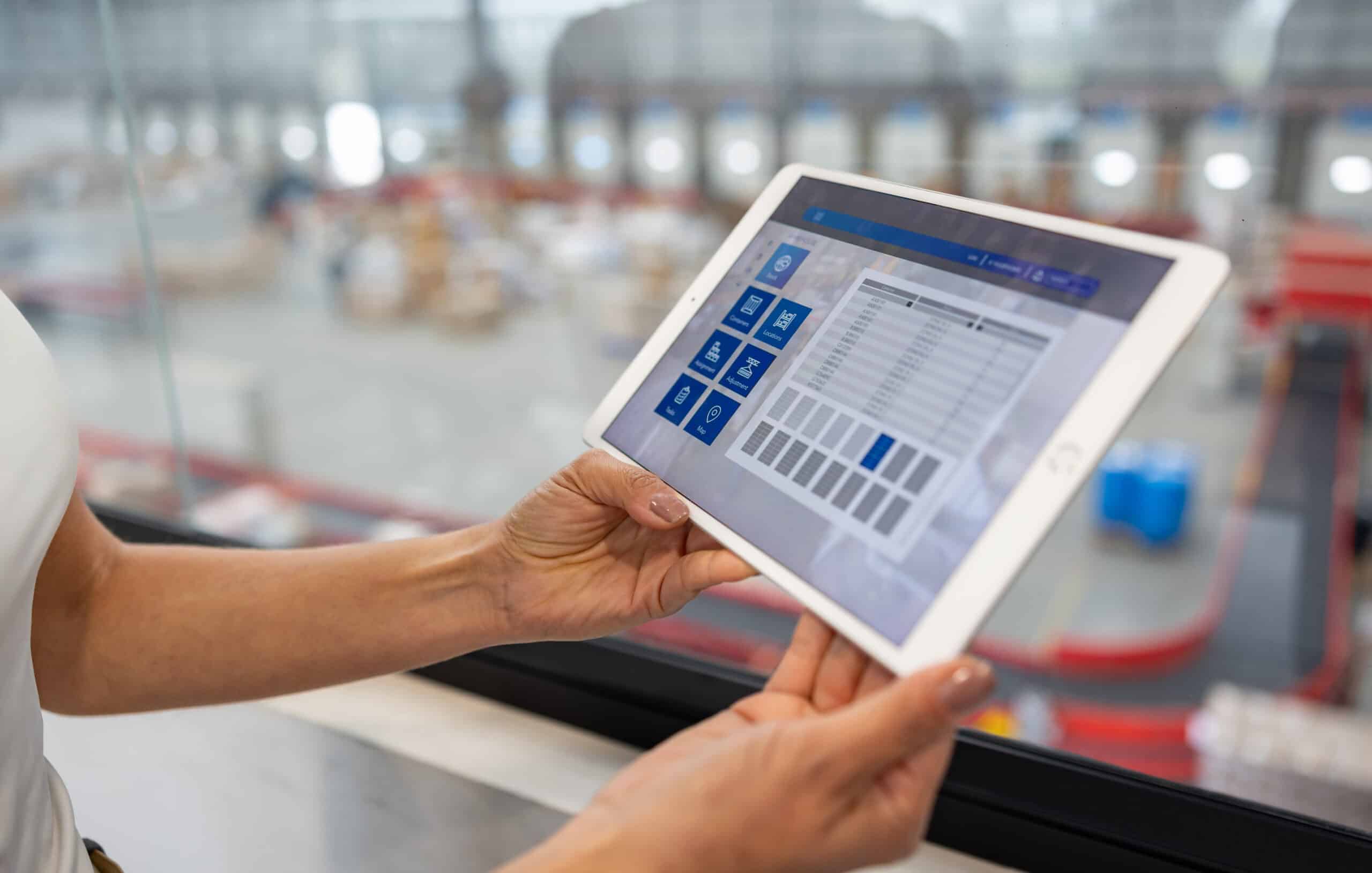 Businesswoman using tablet symbolizing enterprise application integration consulting