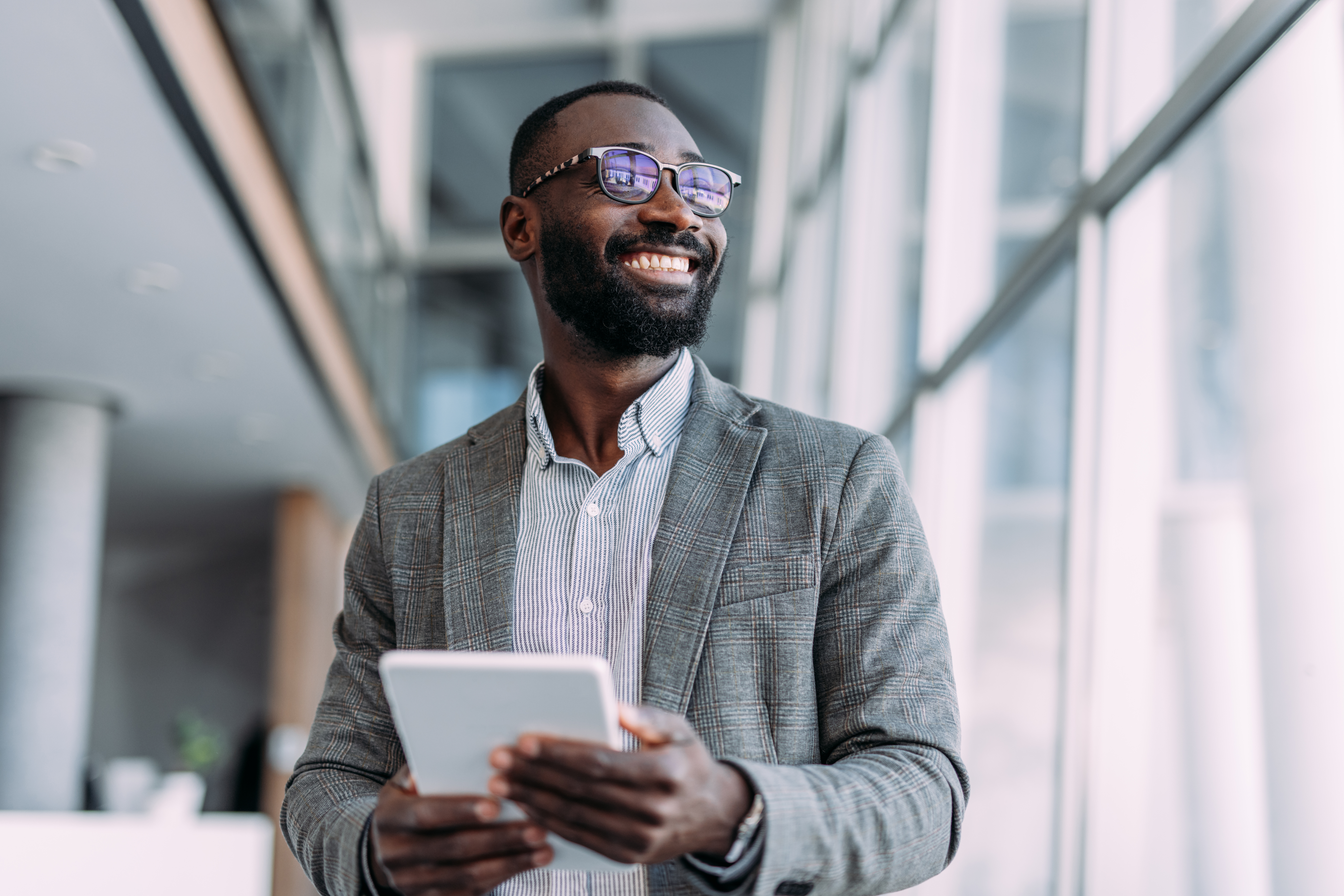 Shot of a handsome businessman using digital table