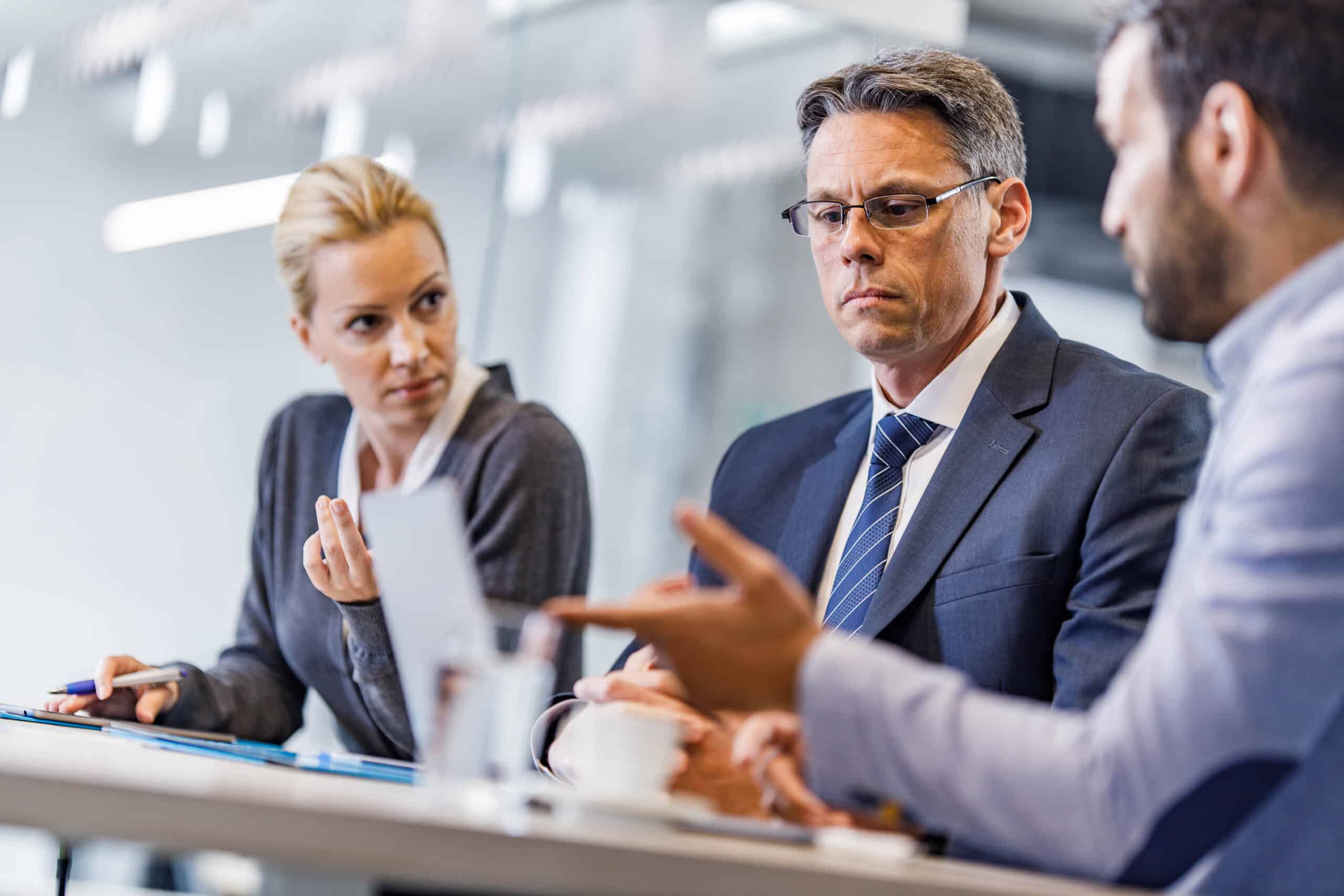 A group of people sitting at a table.