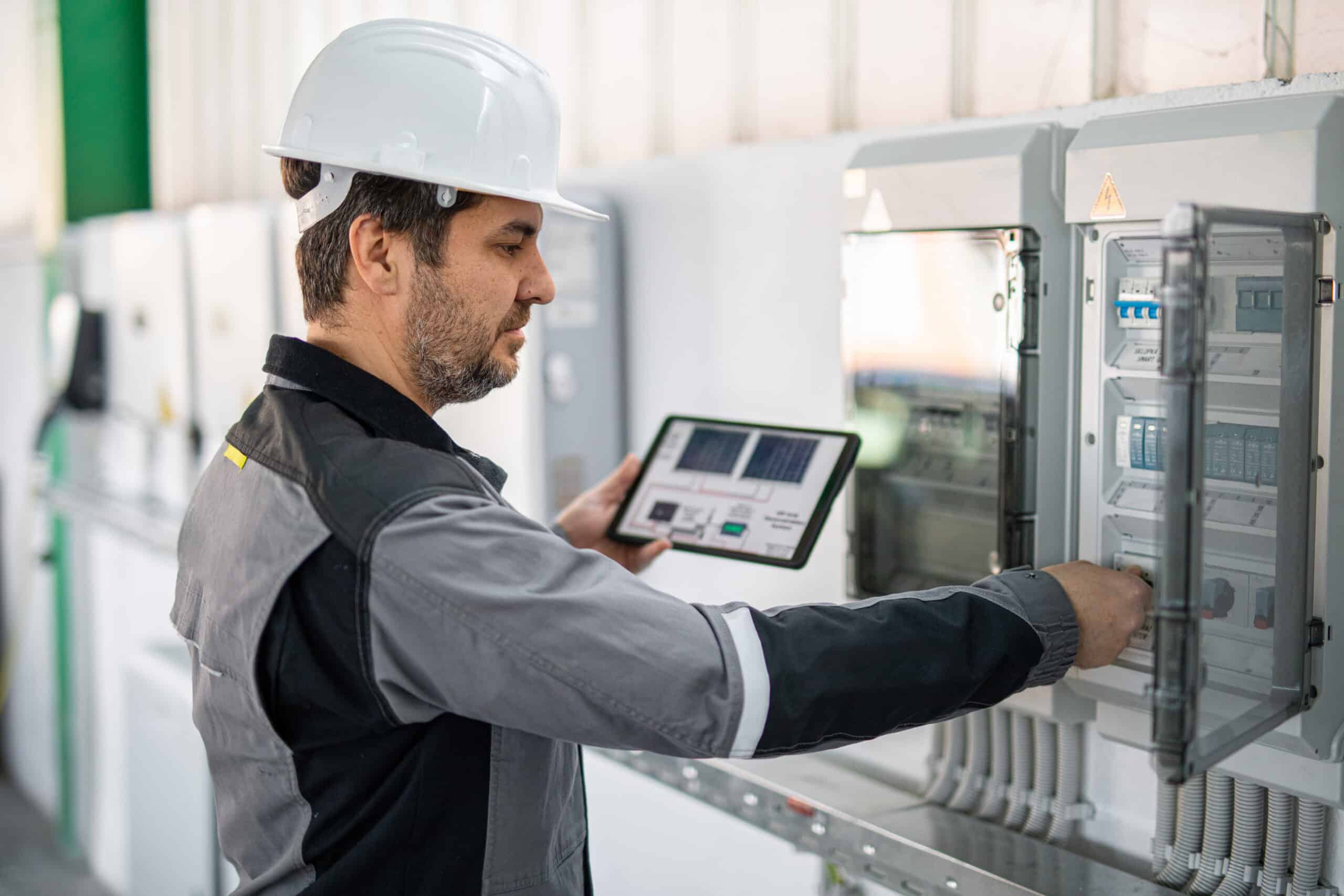 Engineer using a digital tablet symbolizing smart building consulting