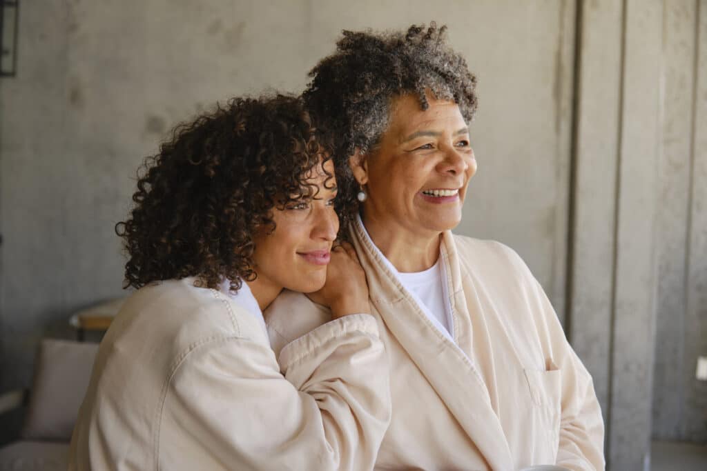 A mother and her adult aged daughter relaxing together at a luxury resort hotel spa.