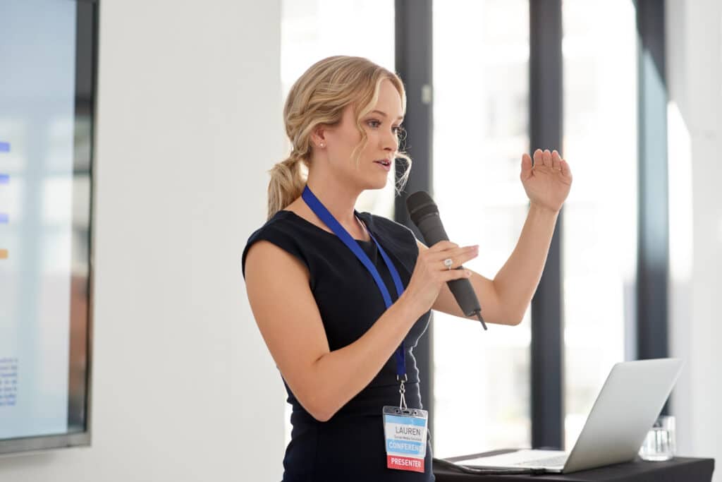 Young businesswoman delivering a presentation representing cost engineering consulting
