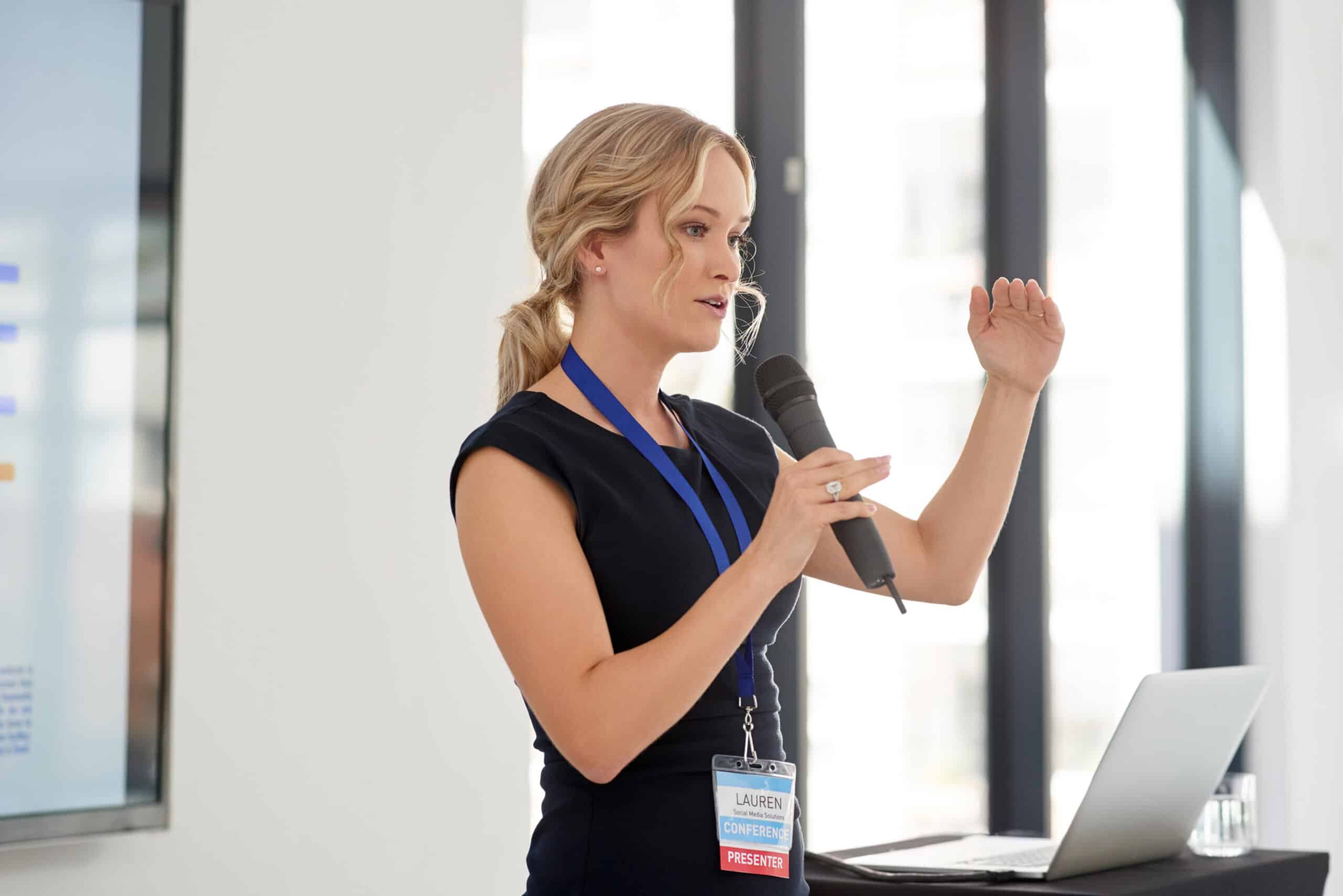 Young businesswoman delivering a presentation representing cost engineering consulting