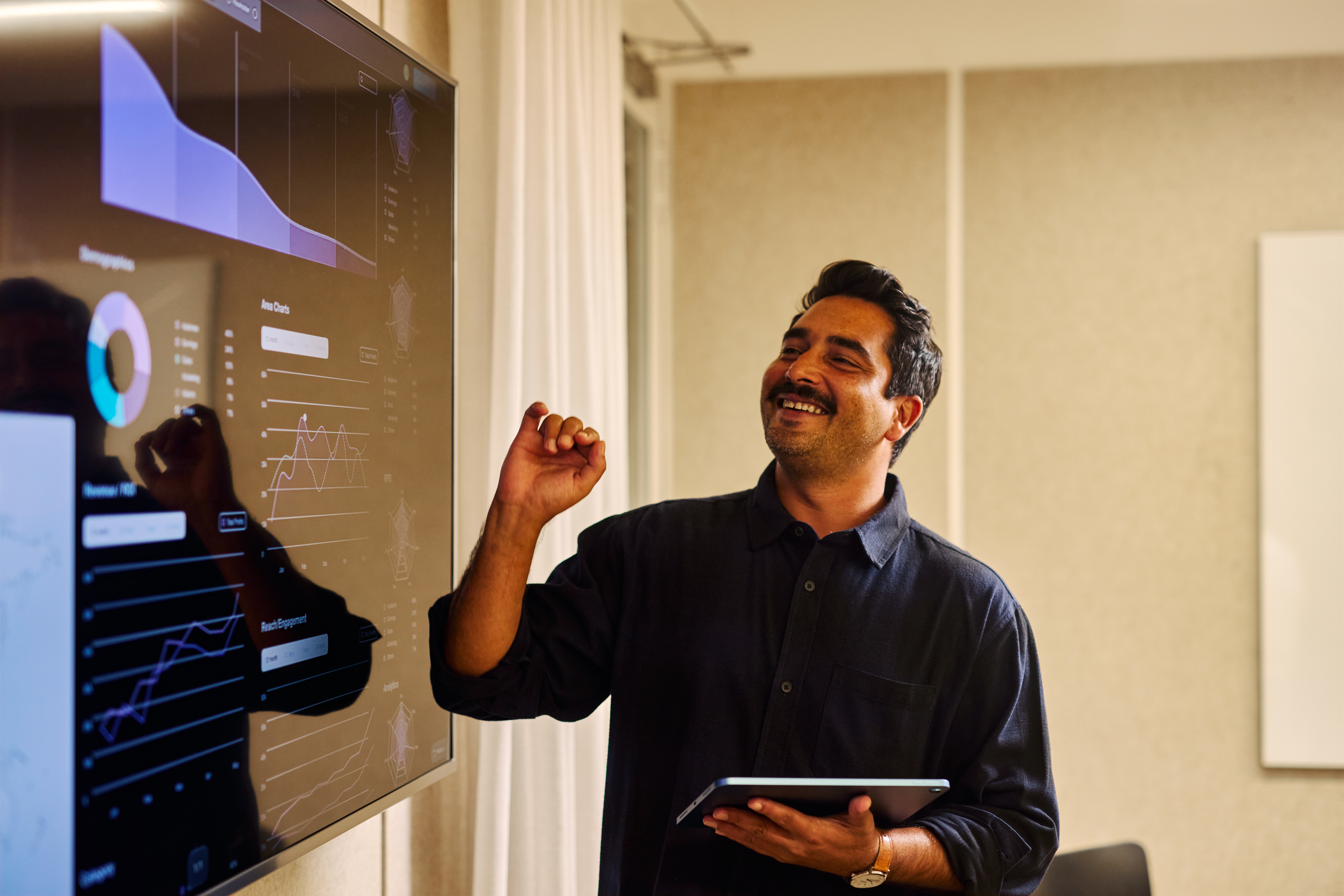 IT professional explaining data dashboard representing platform engineering consulting
