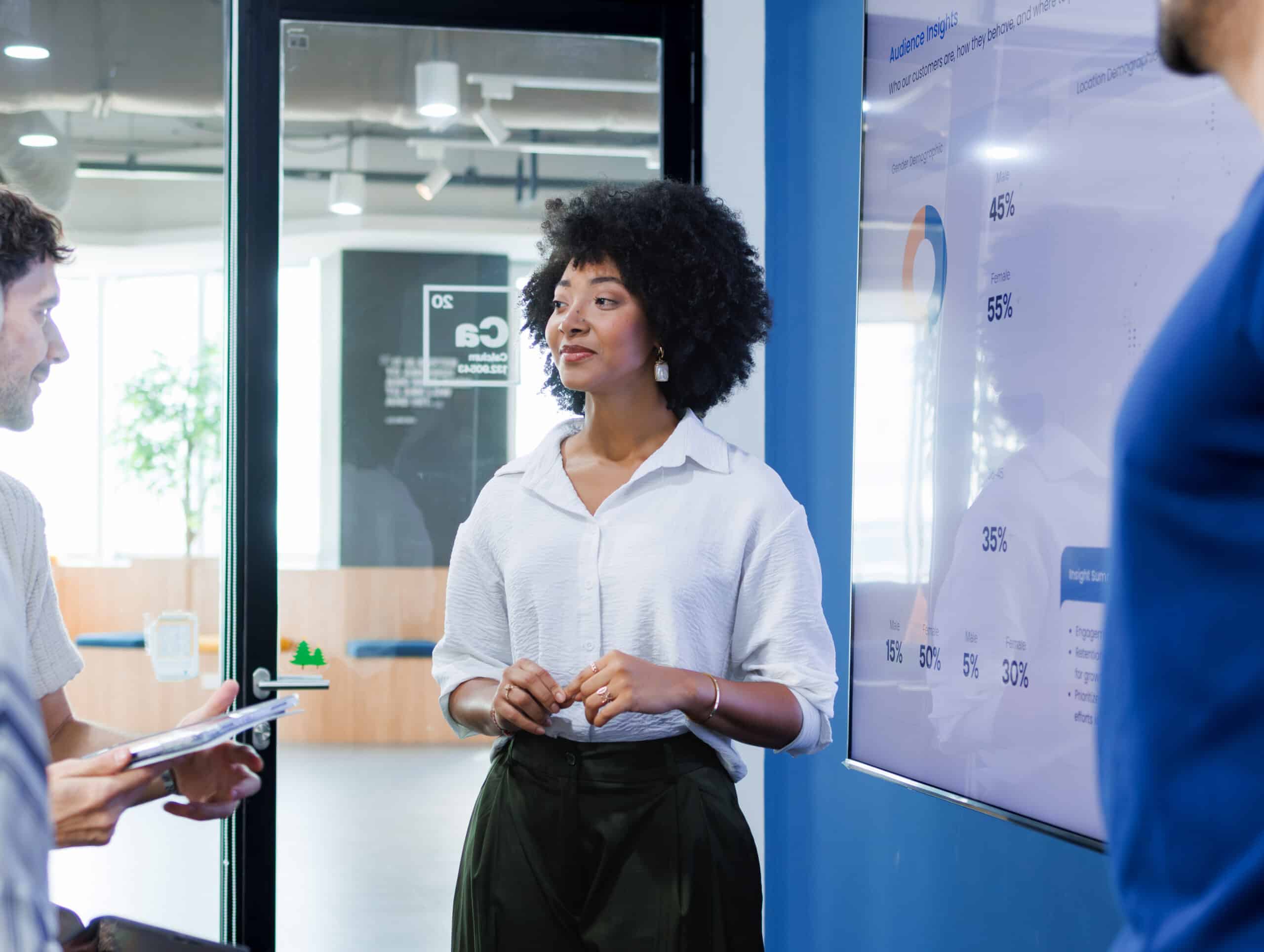 Professional Black businesswoman leads a discussion representing product innovation consulting