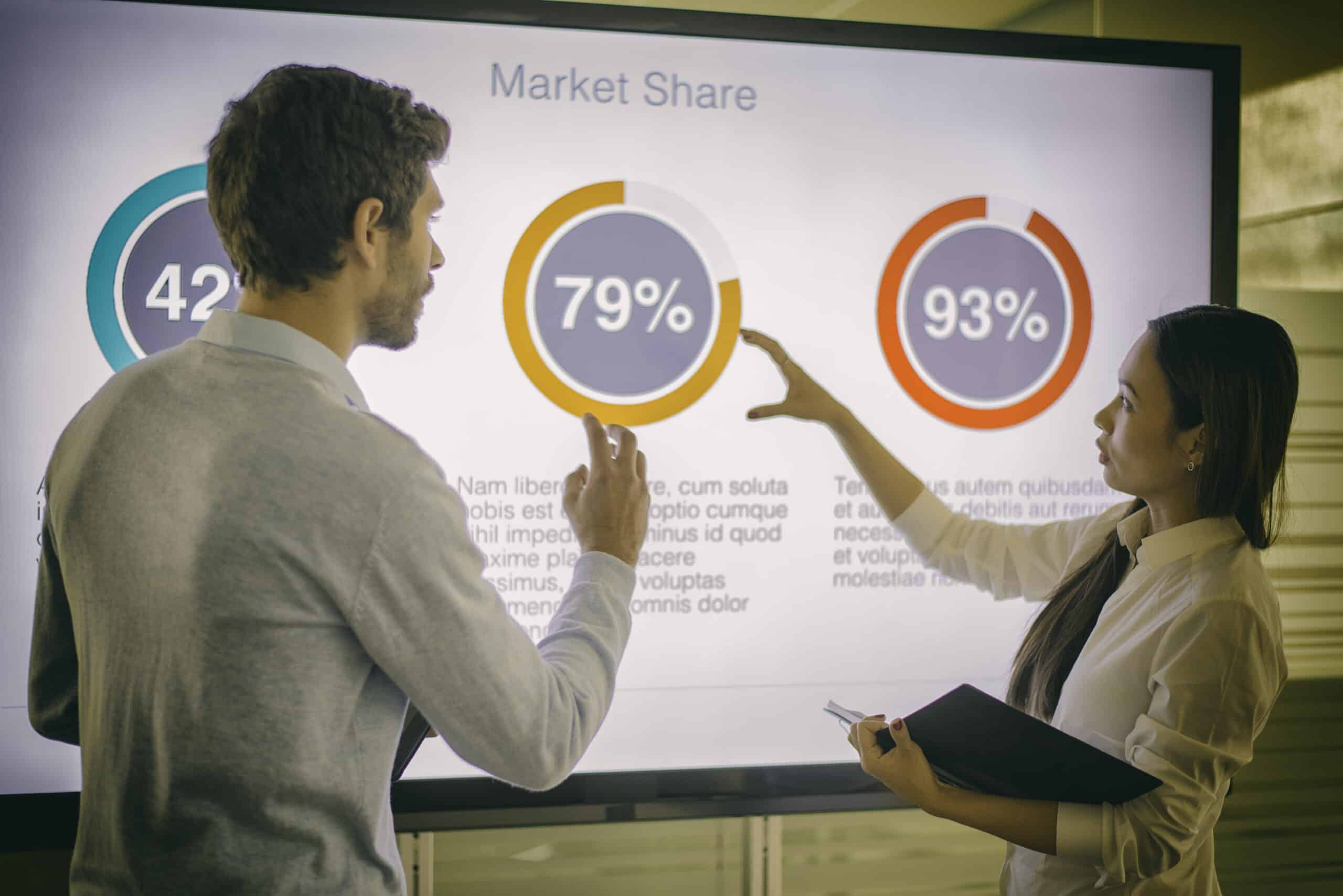 Businesswoman and businessman talking representing revenue growth consulting