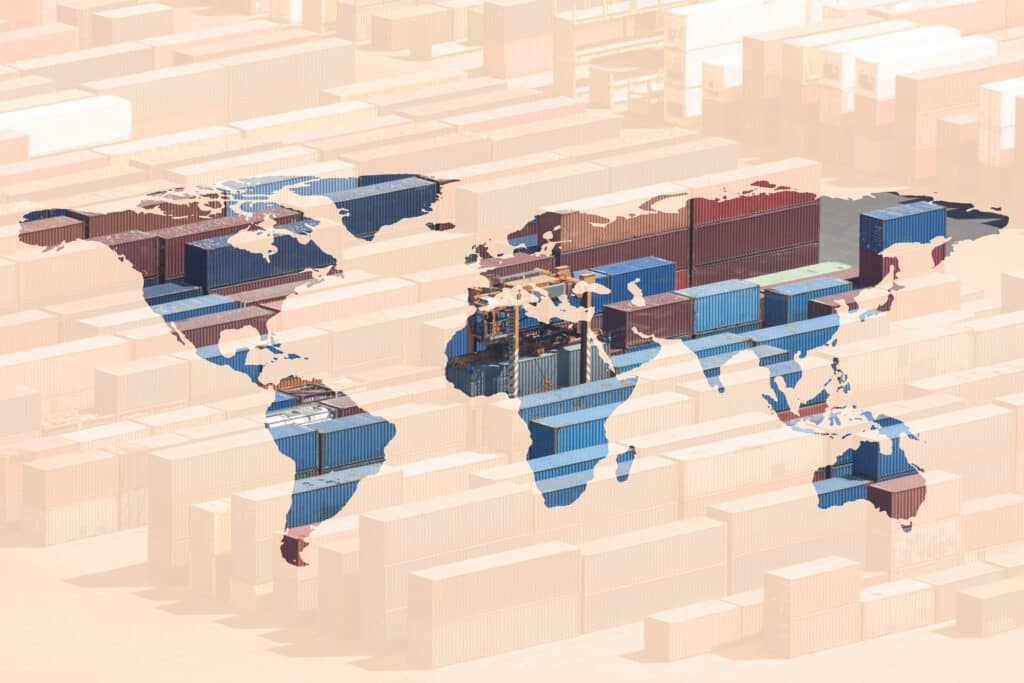 World map overlay on containers, symbolizing global trade and semiconductor supply chain resilience.