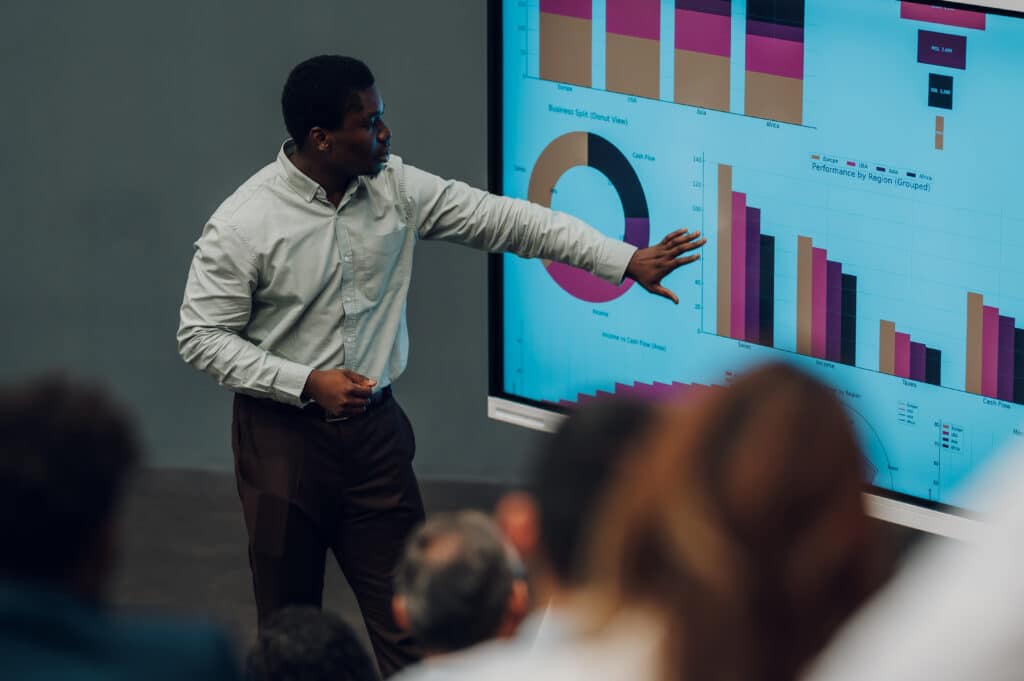 Entrepreneur presenting business data analytics representing supply chain optimization consulting