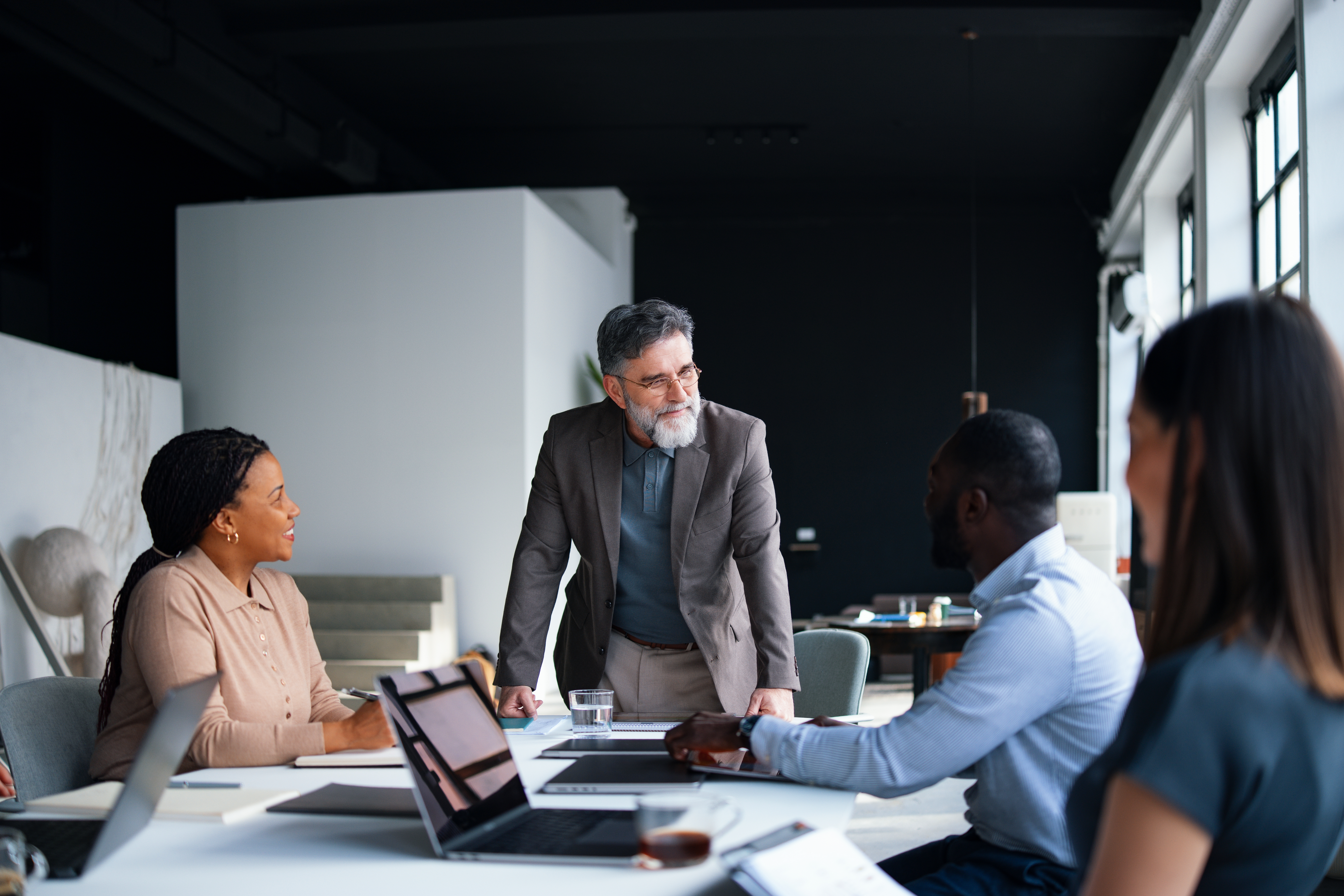 Team Engaged in a Collaborative Business Meeting representing technology due diligence consulting