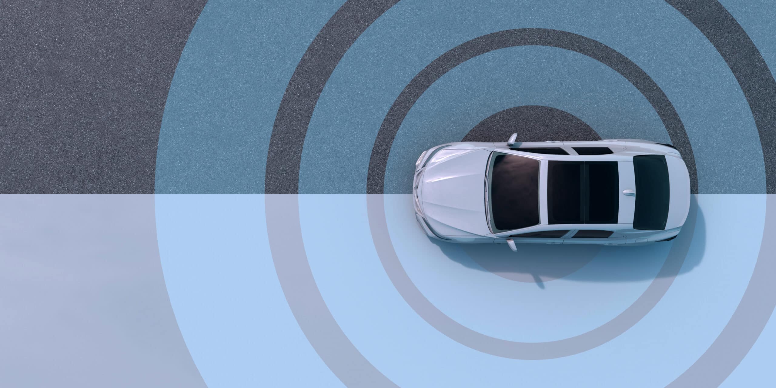 Top view of a car with radar-like circles, highlighting automotive cybersecurity consulting tech.