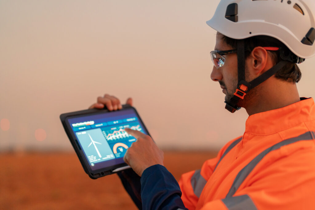 Engineer in a safety suit representing field service consulting