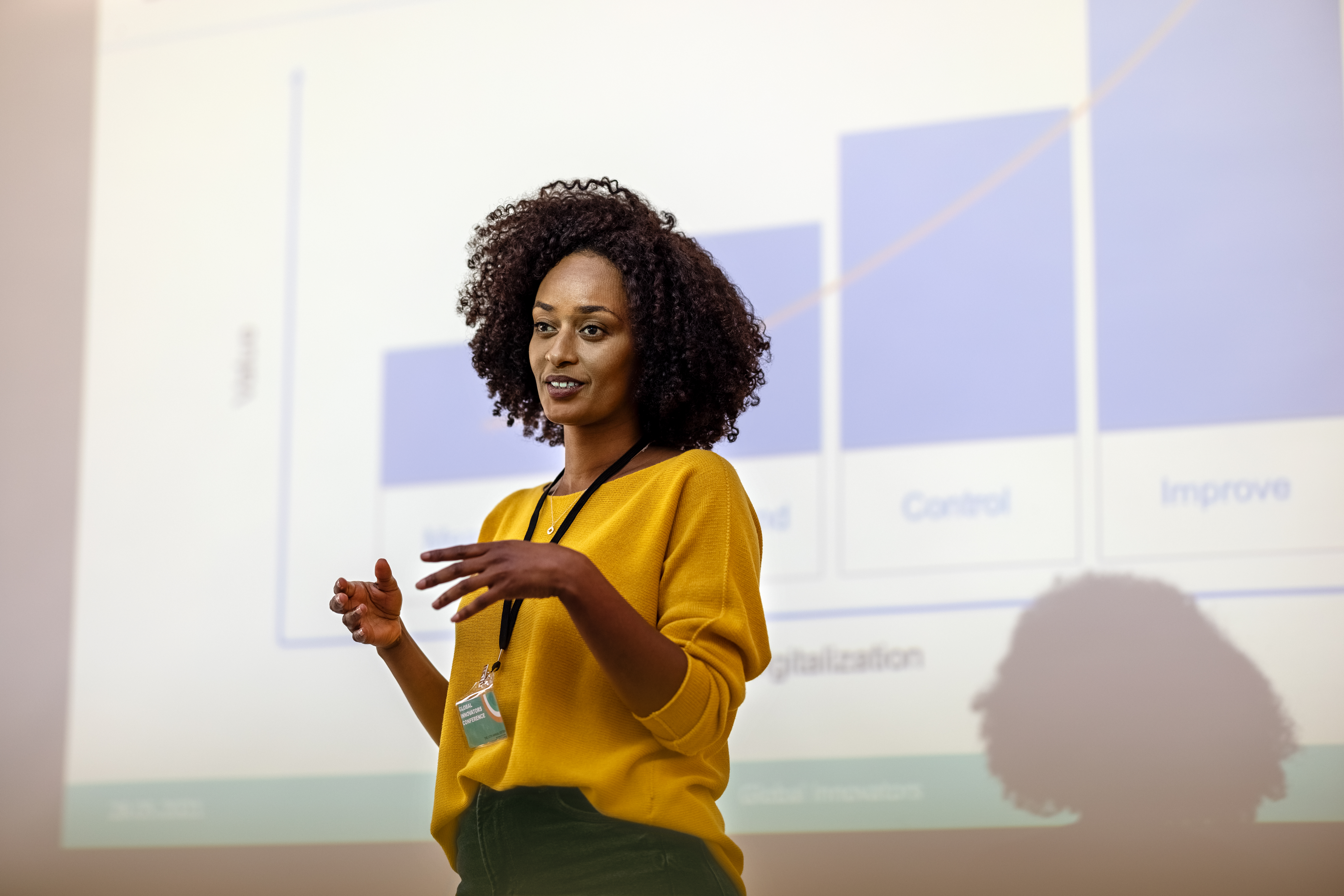 Businesswoman giving presentation on the importance of manufacturing hr consultancy services