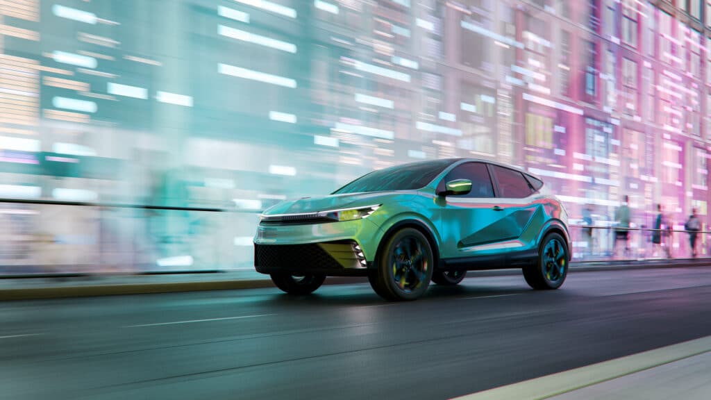 A teal SUV, built as automakers localize without surrendering scale, speeds past city lights.