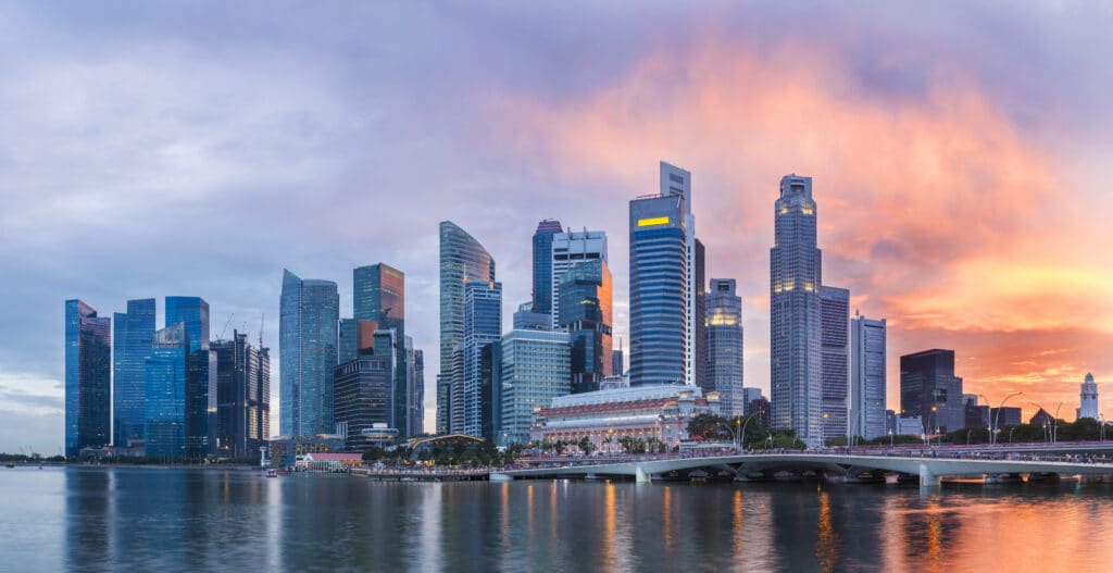 Singapore Marina Bay skyline at twilight for P&C Global Singapore office announcement at One Fullerton.