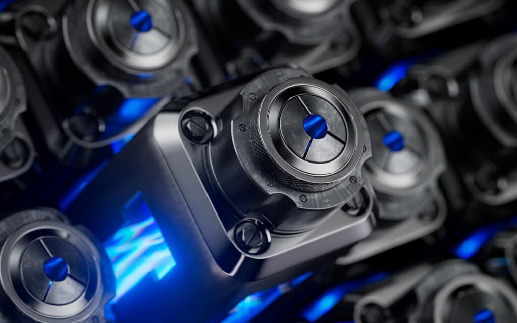 Close-up of futuristic machinery reflects the economics of EV lifecycle value in its blue glow.